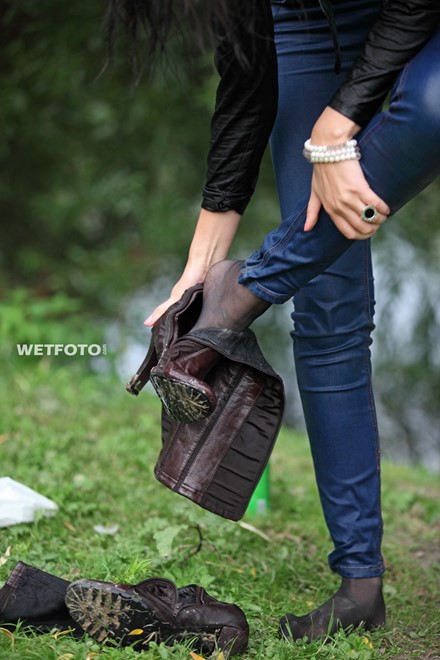 wet girl brunette get wet fully clothed skinny jeans jacket denim tights leather boots heels lake