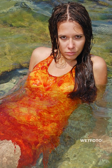 wet girl brunette wet hair get wet swimming fully clothed orange dress sea