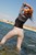 wet girl brunette wet hair get wet soaked swimming fully clothed white jeans blouse heels clothes sea