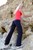 wet girl get wet wet hair fully clothed pants shirt sport sneakers sea