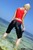 wet girl get wet wet hair fully clothed pants shirt sport sneakers sea