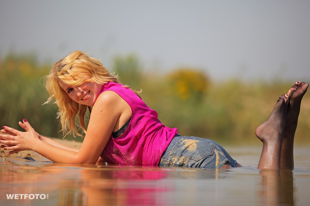 wet girl get wet blouse denim shorts tights high heels swim fully clothed lake
