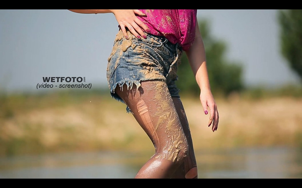 wet girl get wet blouse denim shorts tights high heels swim fully clothed lake