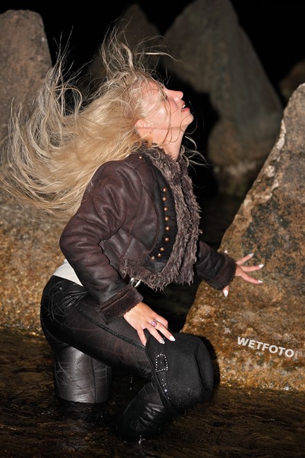 wet girl blonde sheepskin coat brown leggings boots high heels hat wet hair get wet soaked swimming fully clothed sea