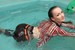 wet girl get wet wet hair jacket pants high heels jacuzzi