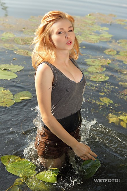 wet girl get wet swim fully clothed wet hair jacket shorts tights high heels lake