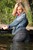 wet girl wet hair get wet jeans golf denim jacket sneakers lake