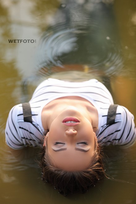 wet girl wet hair get wet t-shirt jacket denim jeans tights high heels swim fully clothed lake