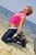 wet girl get wet wet hair fully clothed jeans t-shirt roller-skates sea