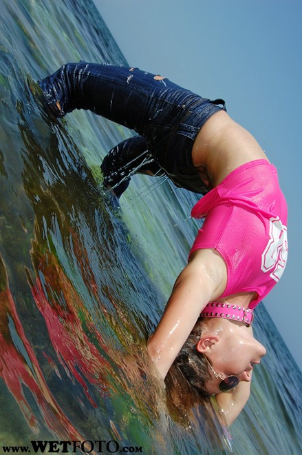 wet girl get wet wet hair fully clothed jeans t-shirt roller-skates sea