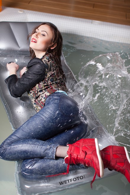 wet girl wet hair get wet top leather jacket tight jeans sneakers fully soaked spa