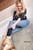 wet girl wet hair get wet leather jacket shirt high-waisted jeans skinny tights sneakers soaking wet jacuzzi
