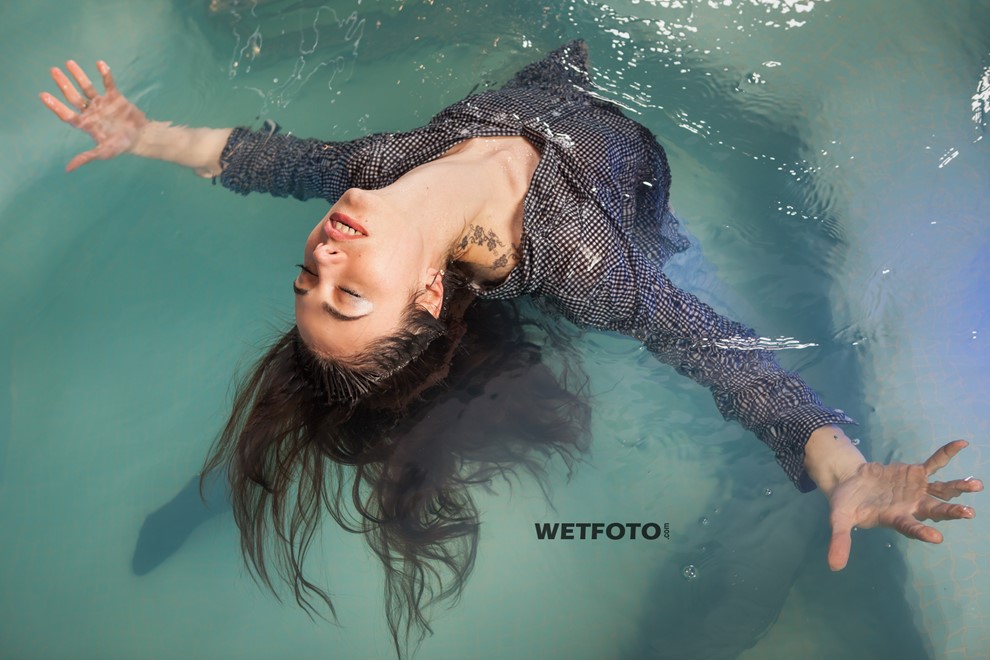 wet girl wet hair get wet coat shirt skinny jeans socks high heels fully soaked spa
