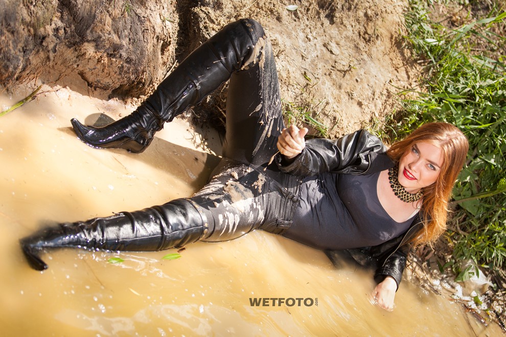 wet girl get wet fully clothed clothes leather jacket leggings tights t-shirt boots high heels lake