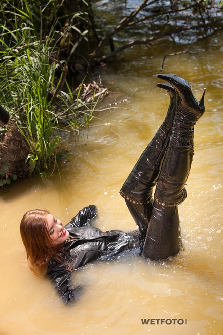 wet girl get wet fully clothed clothes leather jacket leggings tights t-shirt boots high heels lake