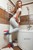 wet girl wet hair get wet short t-shirt skinny jeans high heels fully soaked bath