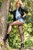 wet woman wet hair get wet leather jacket denim shirt short shorts tights high heels boots lake