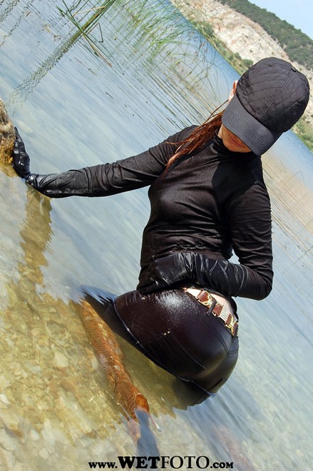 wet girl get wet wet hair fully clothed jacket jeans baseball cap golf gloves leather boots river