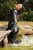 wet woman wet hair get wet leather jacket blouse leggings high heels shoes lake