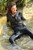 wet woman wet hair get wet leather jacket blouse leggings high heels shoes lake