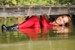 wet girl wet hair get wet blouse denim shorts stockings high heels boots swim fully clothed lake