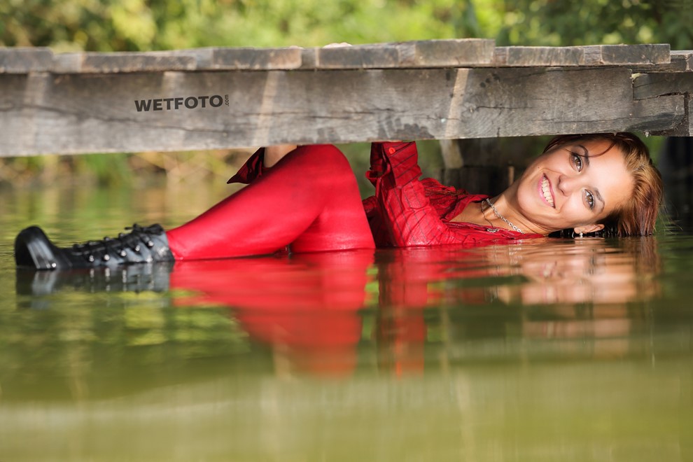wet girl wet hair get wet blouse denim shorts stockings high heels boots swim fully clothed lake