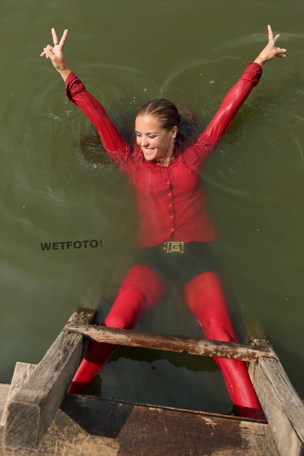 wet girl wet hair get wet blouse denim shorts stockings high heels boots swim fully clothed lake
