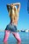 wet girl get wet wet hair fully clothed leggings top denim skirt shoes sea