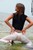 wet girl get wet wet hair fully clothed t-shirt pants high heels sea