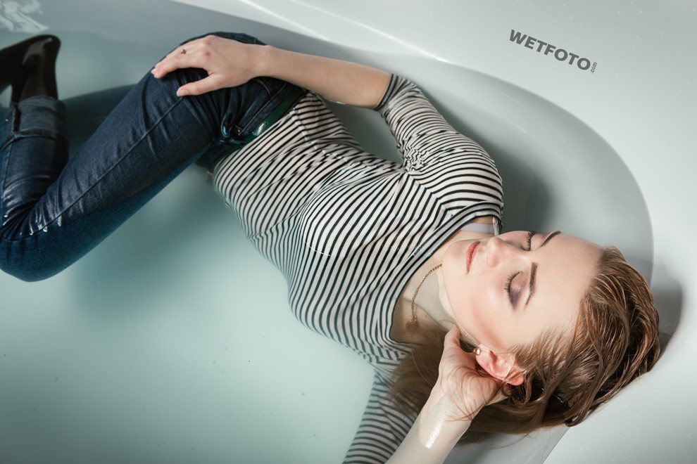wet girl fully clothed get wet soaking wet striped sweater tight jeans boots high heels bath