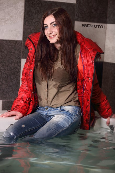 wet girl fully clothed get wet soaking wet blouse anorak tight jeans tights jacuzzi