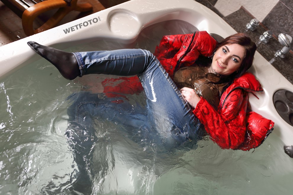 wet girl fully clothed get wet soaking wet blouse anorak tight jeans tights jacuzzi