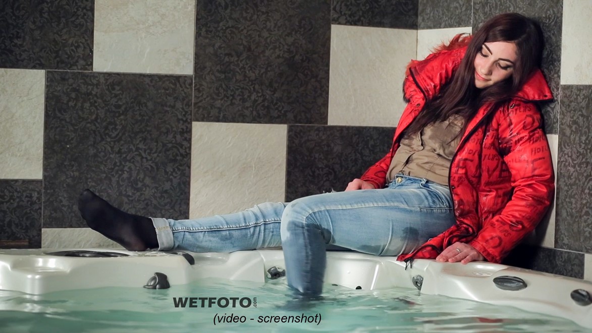 wet girl fully clothed get wet soaking wet blouse anorak tight jeans tights jacuzzi