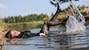 wet girl wet hair get wet soaked swimming fully clothed blouse leather suit jacket skirt tights river