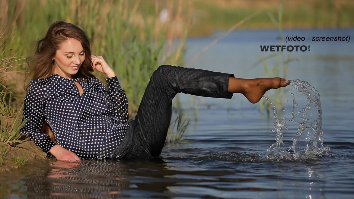 wet girl wet hair get wet swimming fully clothed blouse tight pants tights lake mud