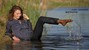 wet girl wet hair get wet swimming fully clothed blouse tight pants tights lake mud