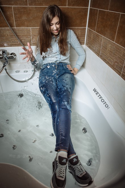 wet girl wet hair get wet fully clothed tights denim shirt tight jeans sneakers shower jacuzzi