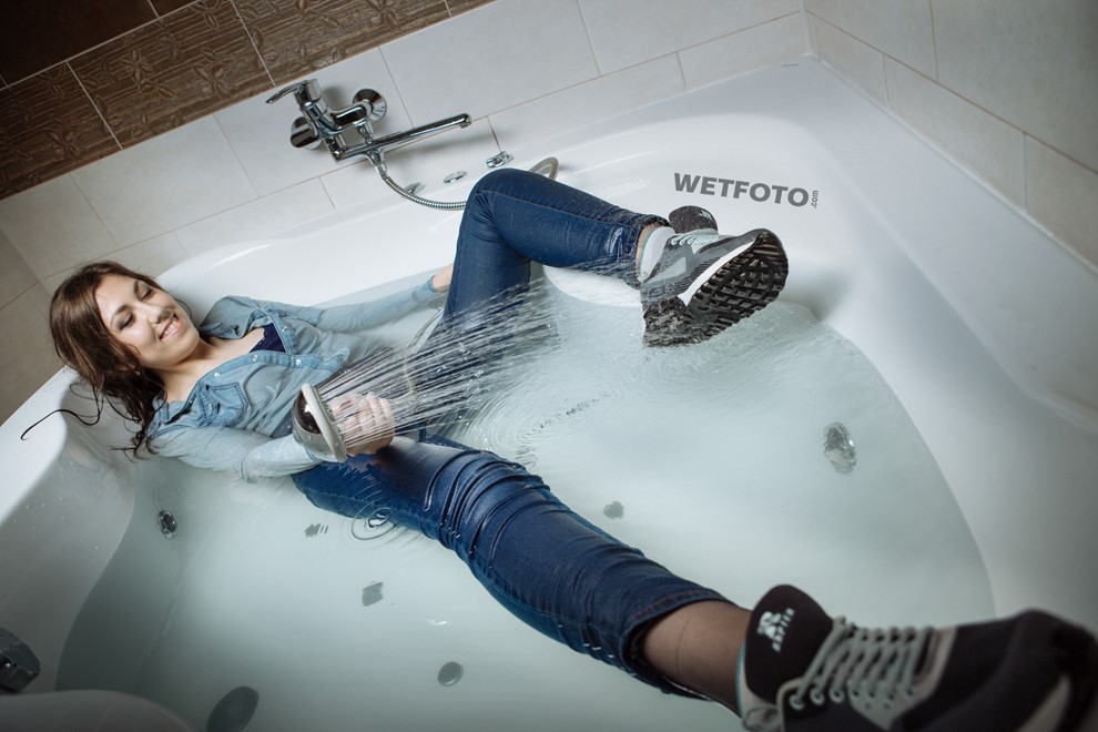 wet girl wet hair get wet fully clothed tights denim shirt tight jeans sneakers shower jacuzzi