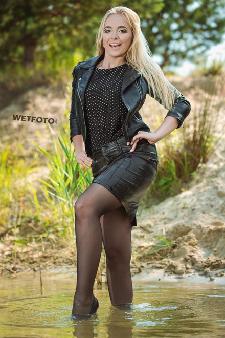 wet girl soaked get wet swimming fully clothed tights leather jacket skirt high heels lake