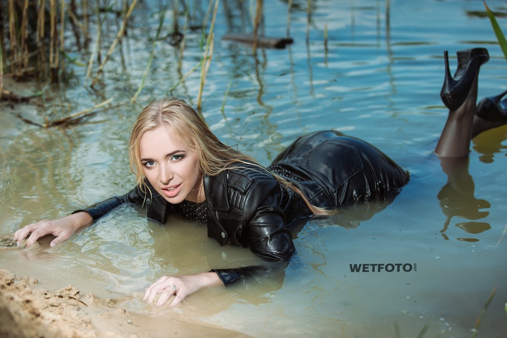 wet girl soaked get wet swimming fully clothed tights leather jacket skirt high heels lake