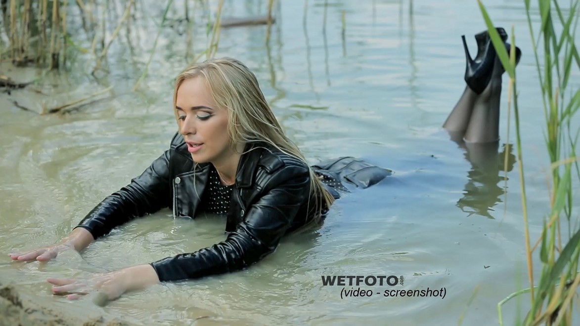 wet girl soaked get wet swimming fully clothed tights leather jacket skirt high heels lake