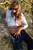 wet woman get wet wet hair fully clothed blouse tight jeans leather boots high heels