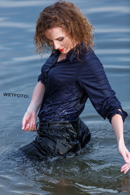 wet girl wet hair get wet swimming fully clothed shirt leather pants high heels lake