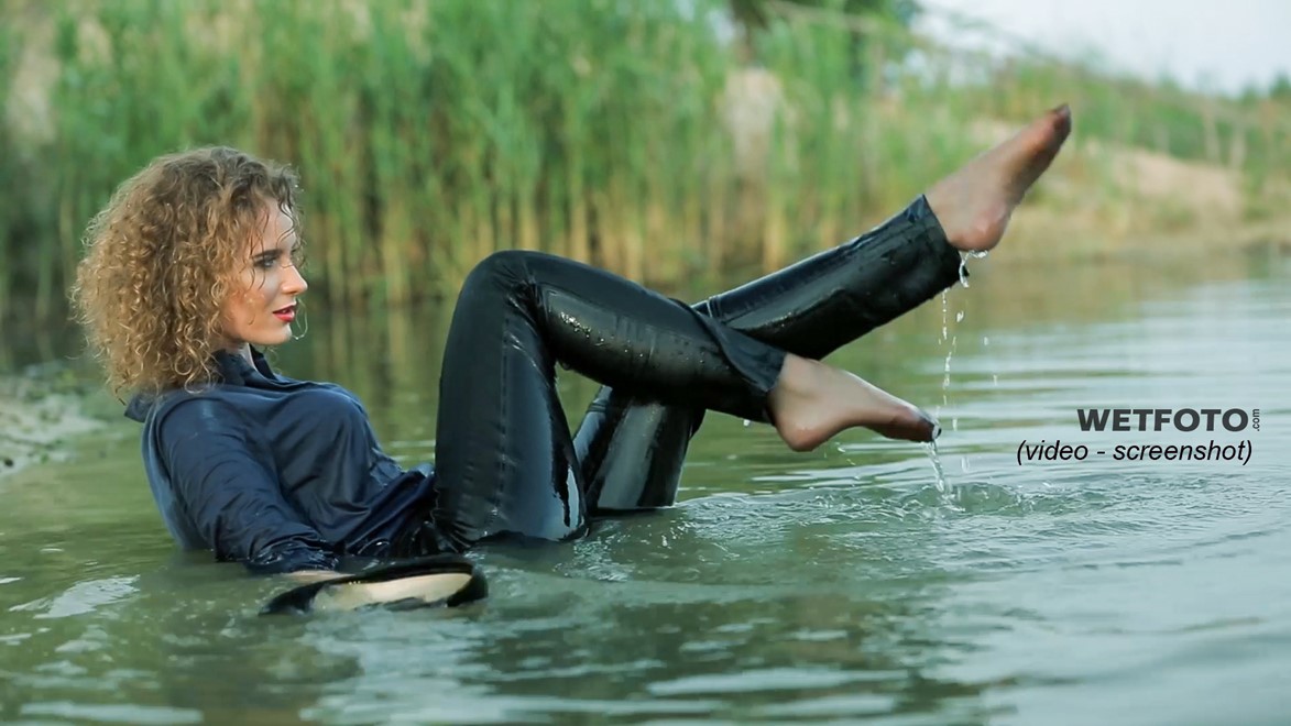 wet girl wet hair get wet swimming fully clothed shirt leather pants high heels lake