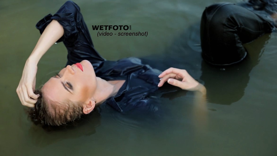 wet girl wet hair get wet swimming fully clothed shirt leather pants high heels lake