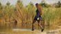 wet girl woman wet hair get wet soaked swim fully clothed skirt leather stockings blouse sneakers lake water