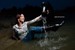 wet girl woman wet hair get wet soaked swimming jeans t-shirt boots high heels lake