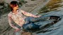 wet girl woman wet hair get wet soaked swimming jeans t-shirt boots high heels lake
