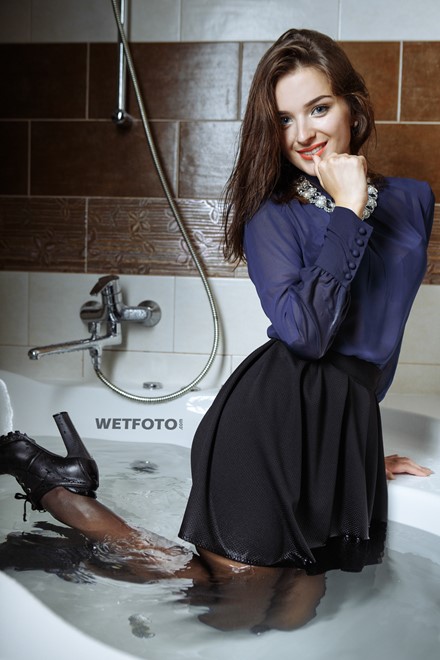 girl wet fully clothed soaked wet hair water skirt blouse stockings boots high heels jacuzzi bath shower