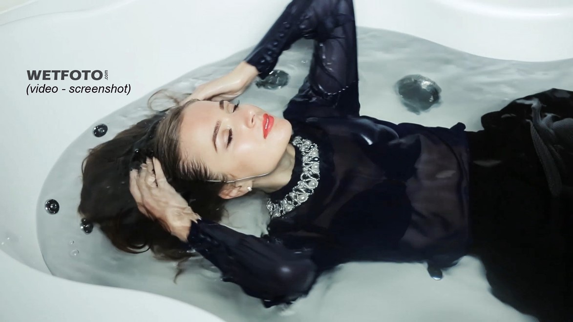 girl wet fully clothed soaked wet hair water skirt blouse stockings boots high heels jacuzzi bath shower